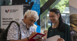 Veteran using a clipboard at an expo